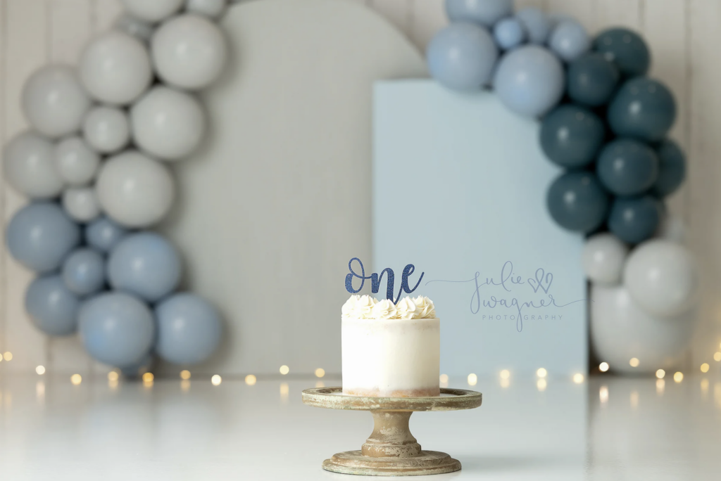 blue backdrop for first birthday photo session utah county